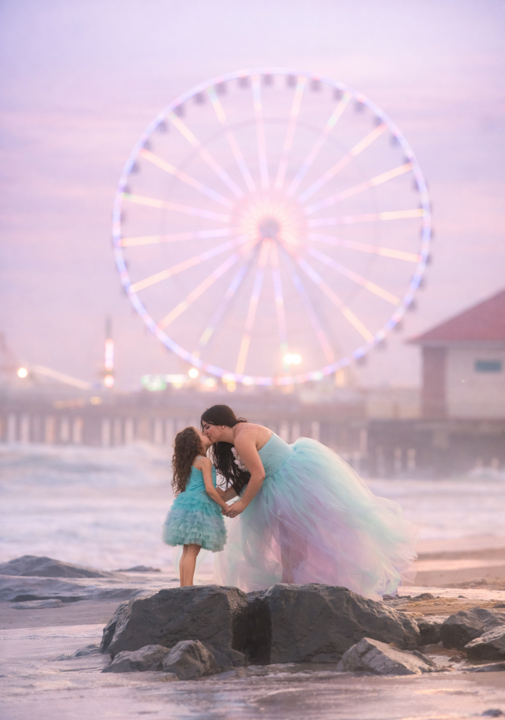 Mother and daughter embracing on the Jersey Shore at sunset during a fine art family photography session