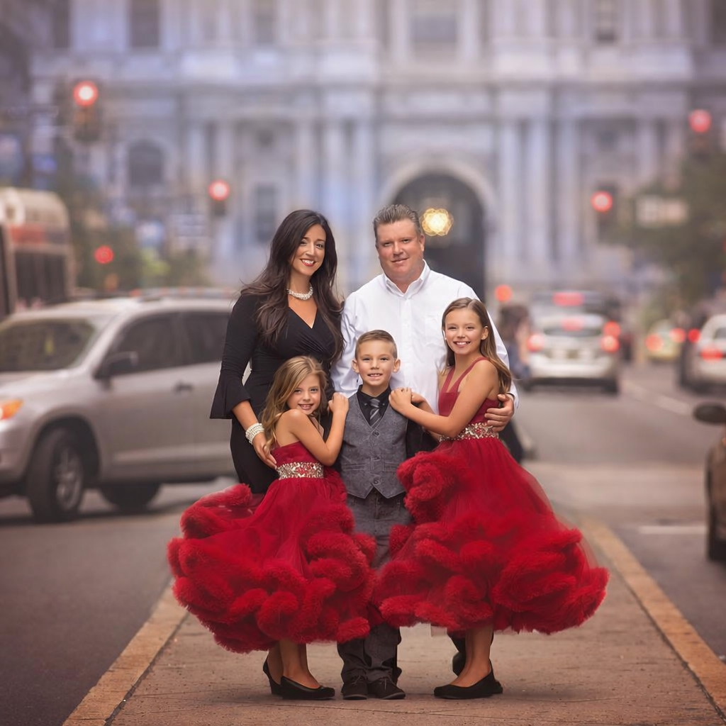 Parents and children photographed together in Center City Philadelphia during a family portrait session.