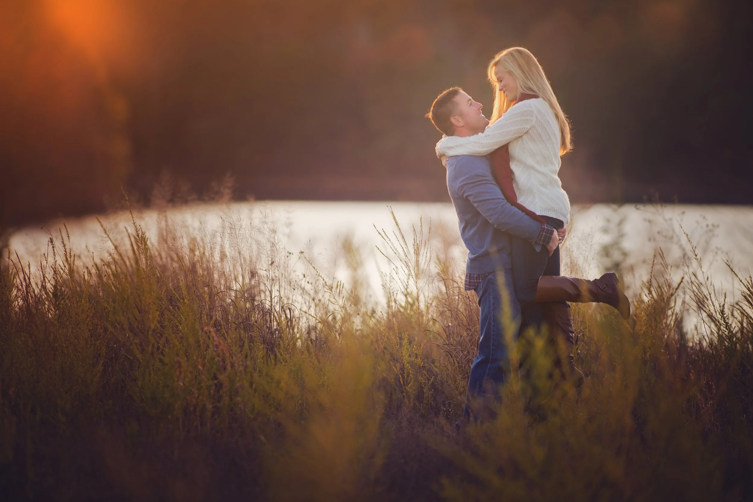 Joyful couples portrait featuring natural movement and genuine connection in an outdoor setting