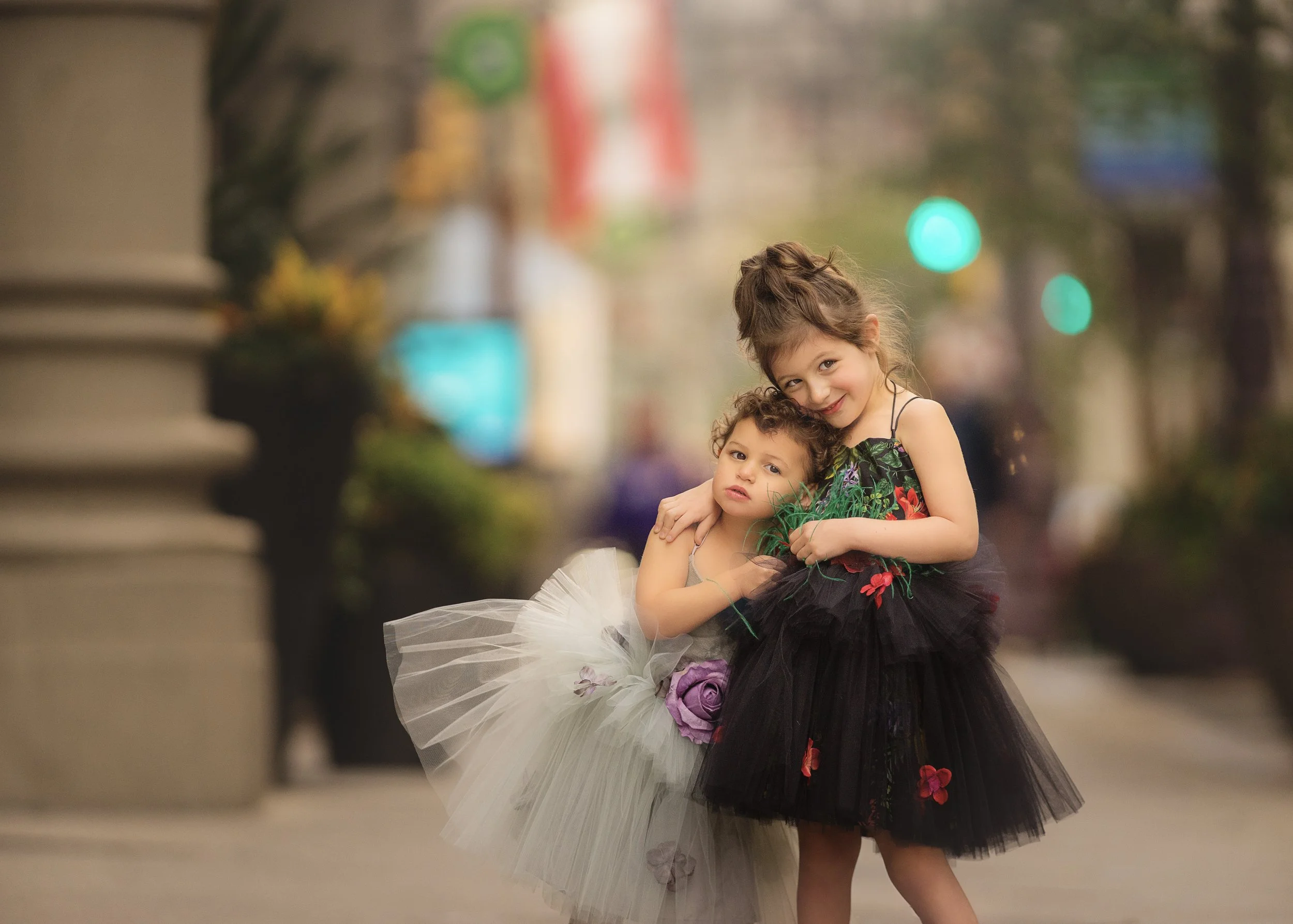 wo sisters hugging during family portrait session in Philadelphia