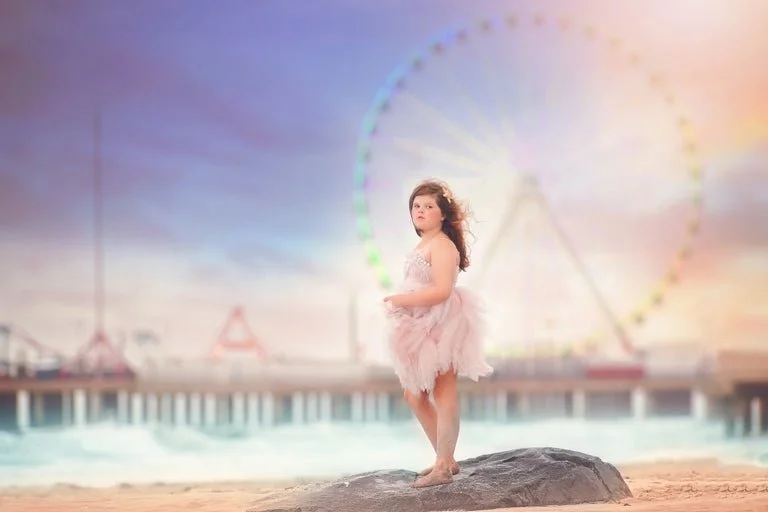 Girl standing on the beach during a magical fine art portrait session on the Jersey Shore at sunset
