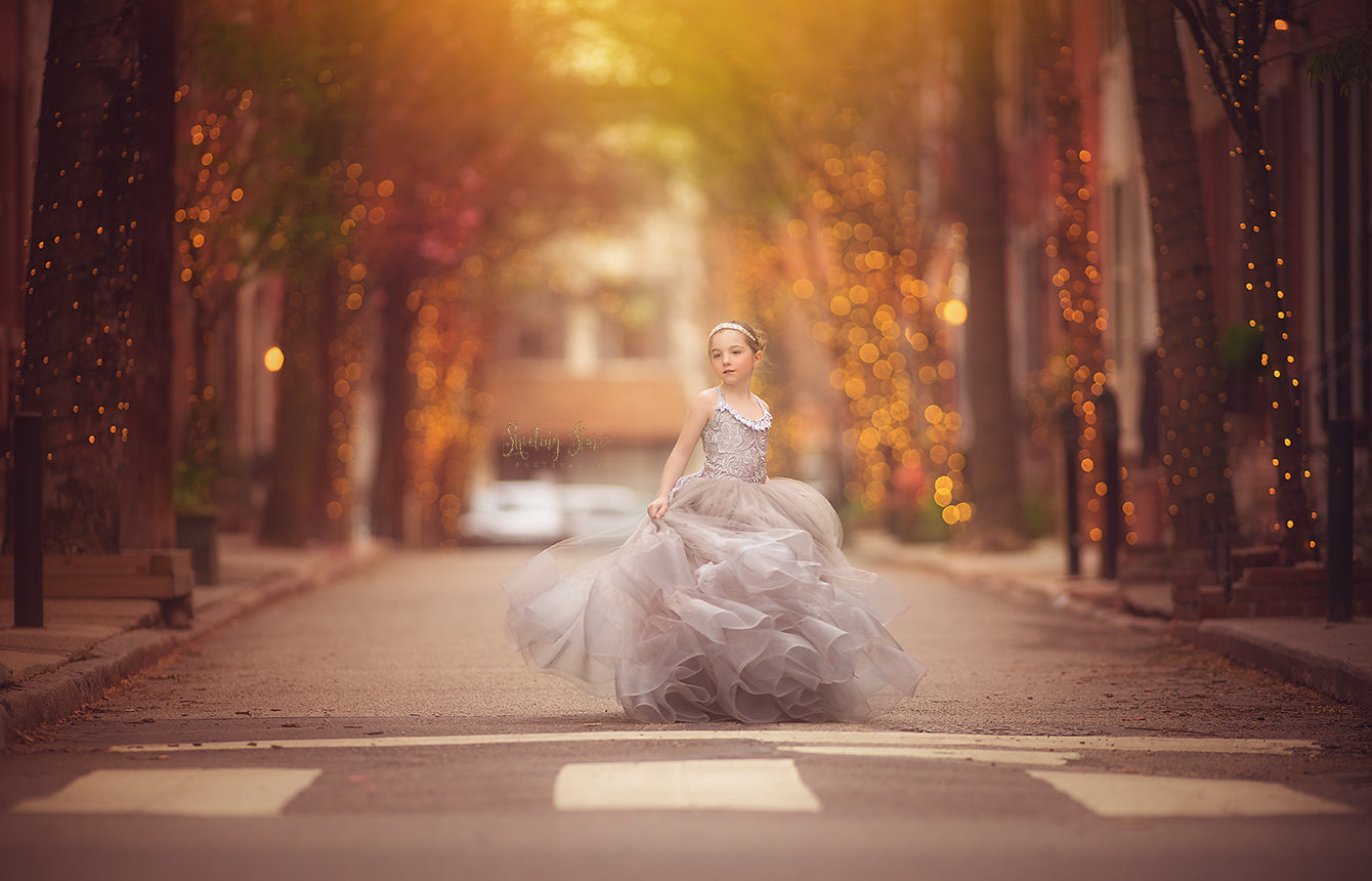 Girl in a flowing dress during a fine art portrait session on Addison Street in Philadelphia.