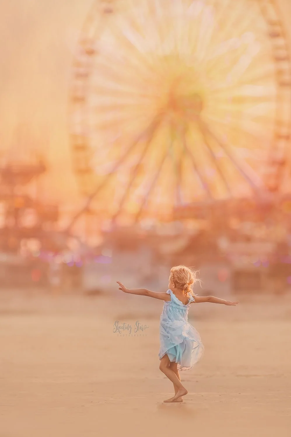 Girl spinning and twirling on the beach in Wildwood New Jersey during a family photo session