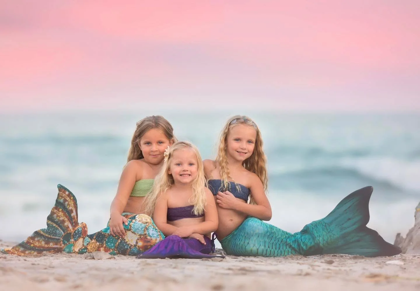 Three little mer angels.