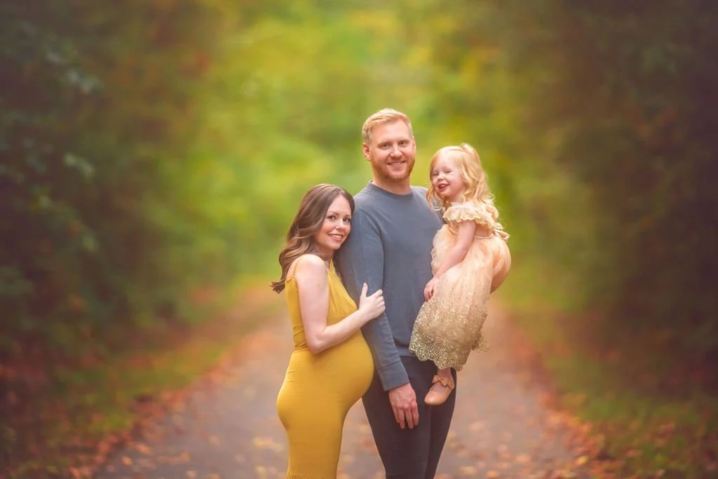 Closeup portrait of a family together during an outdoor maternity photography session in South Jersey.