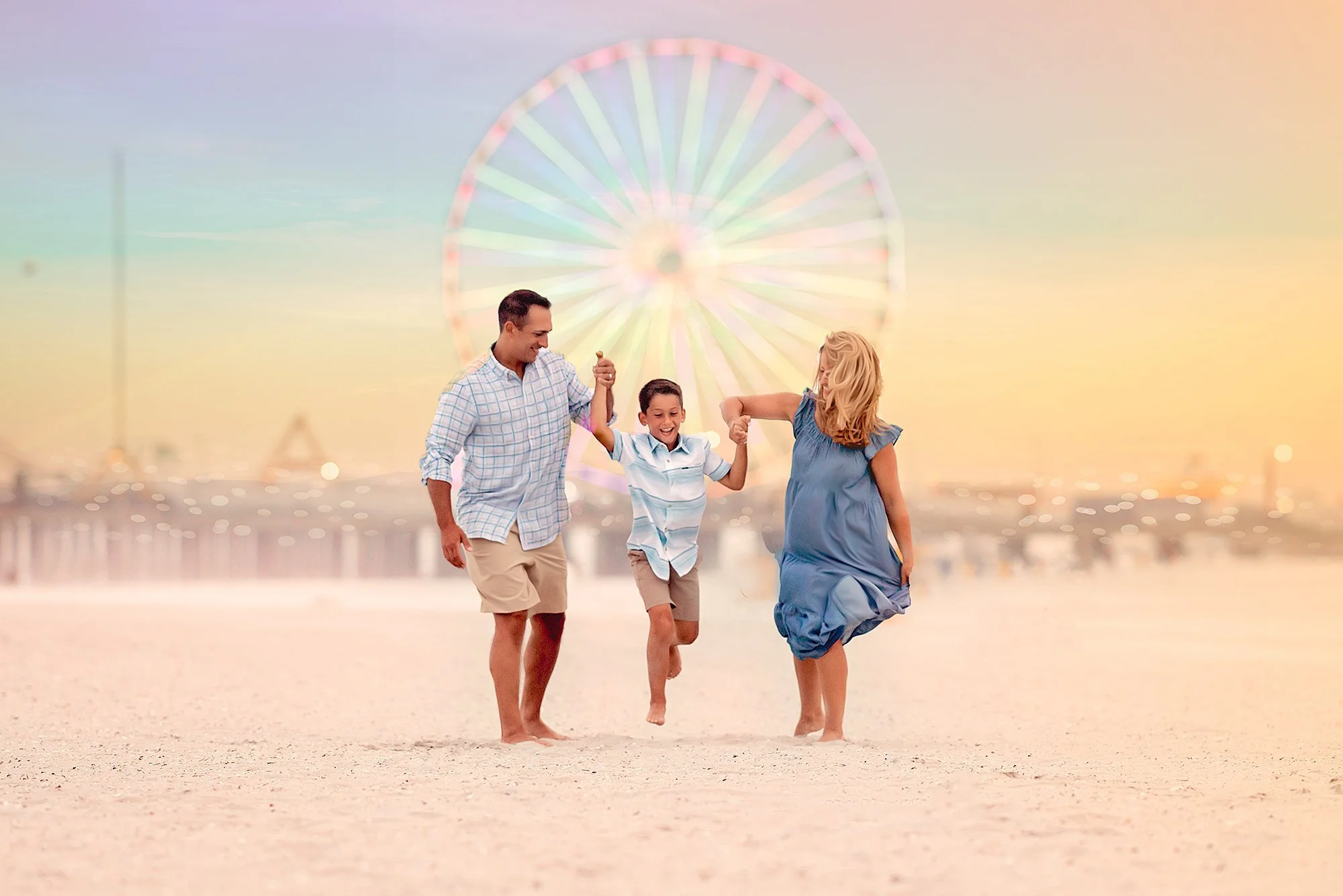 Family running together along the beach at sunset with a Ferris Wheel in the background, New Jersey shore family photography