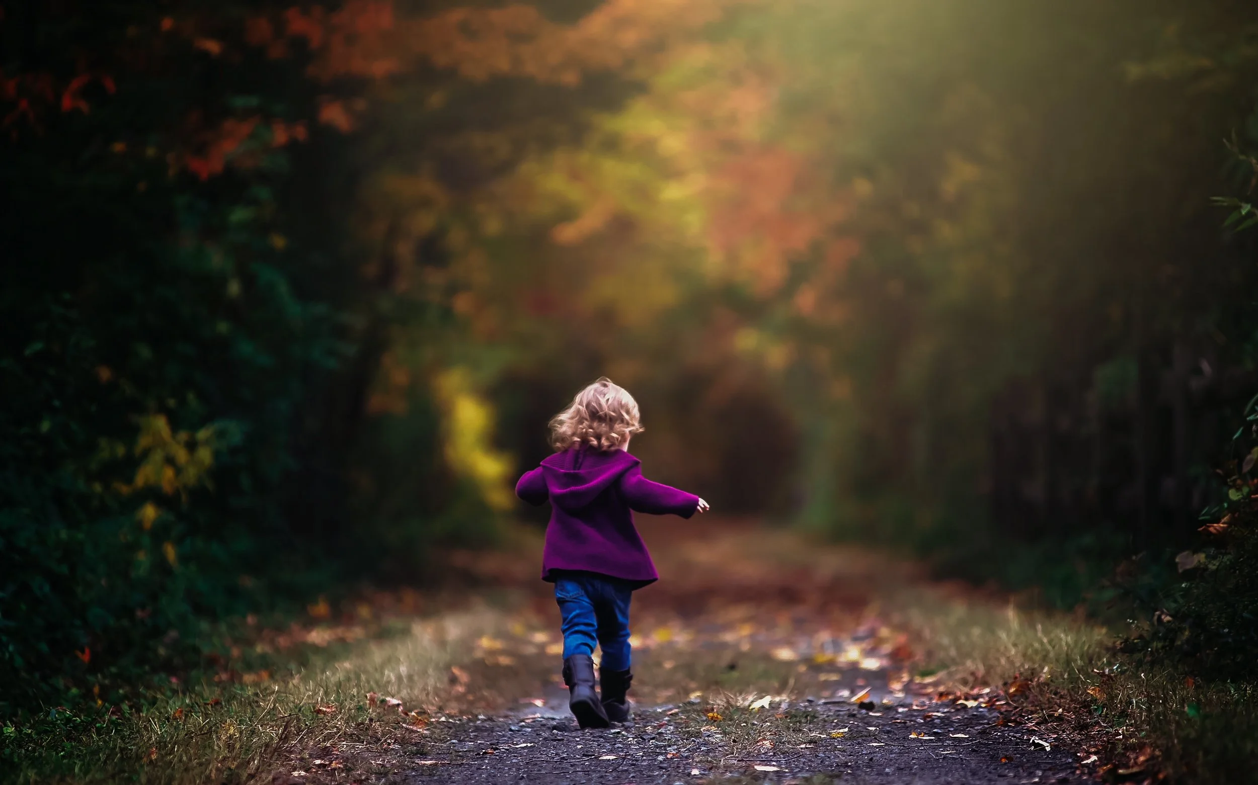 happy toddler running during outdoor portrait session in South Jersey