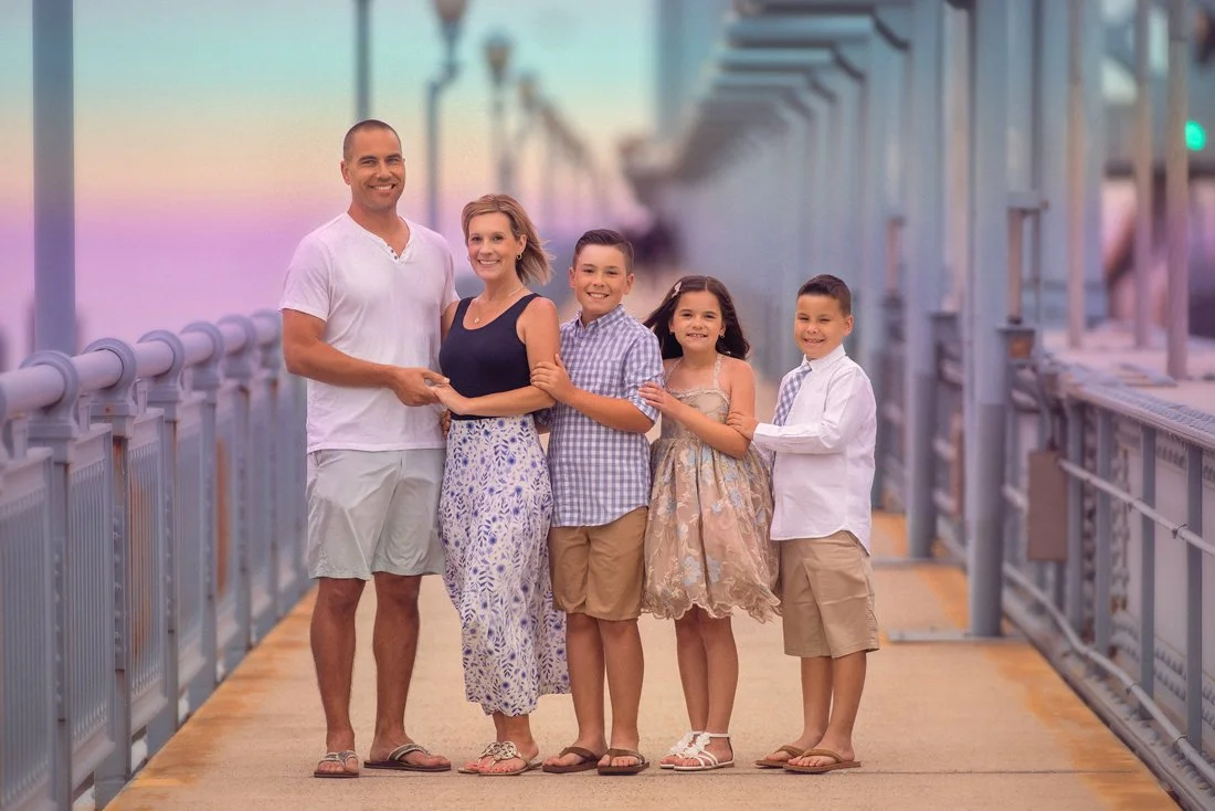 Family portrait on the Ben Franklin Bridge in Philadelphia by a fine art family photographer
