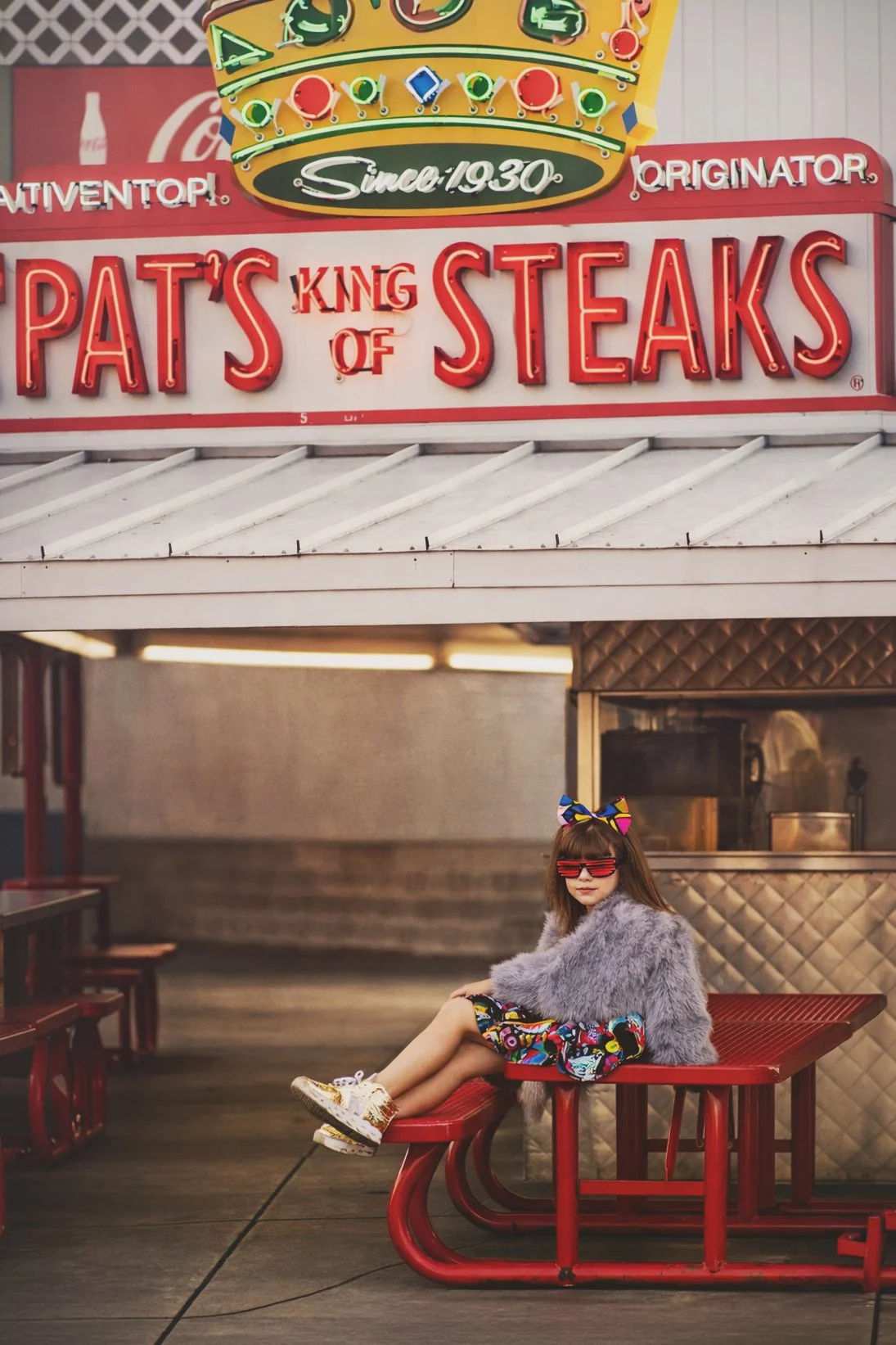 Child portrait at Pat’s King of Steaks in South Philadelphia by Philadelphia family photographer