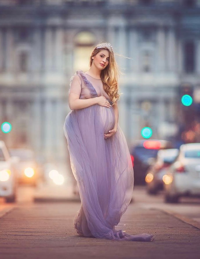 Pregnant mother in a silver dress during a maternity photography session in Philadelphia.