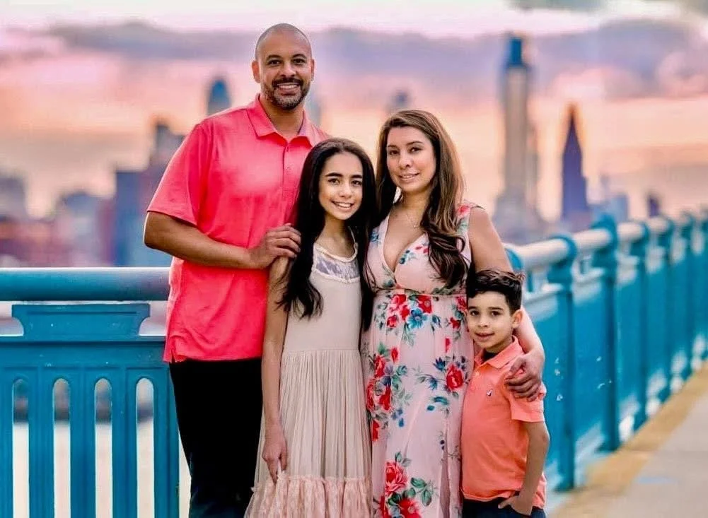 editorial family portrait of family on the ben franklin bridge in philadelphia