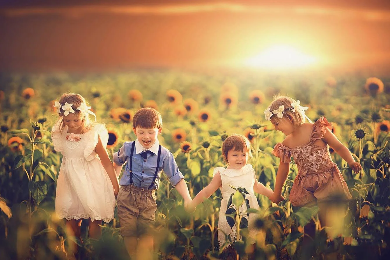 fine art summer portrait of children in a sunflower field in South Jersey during golden hour