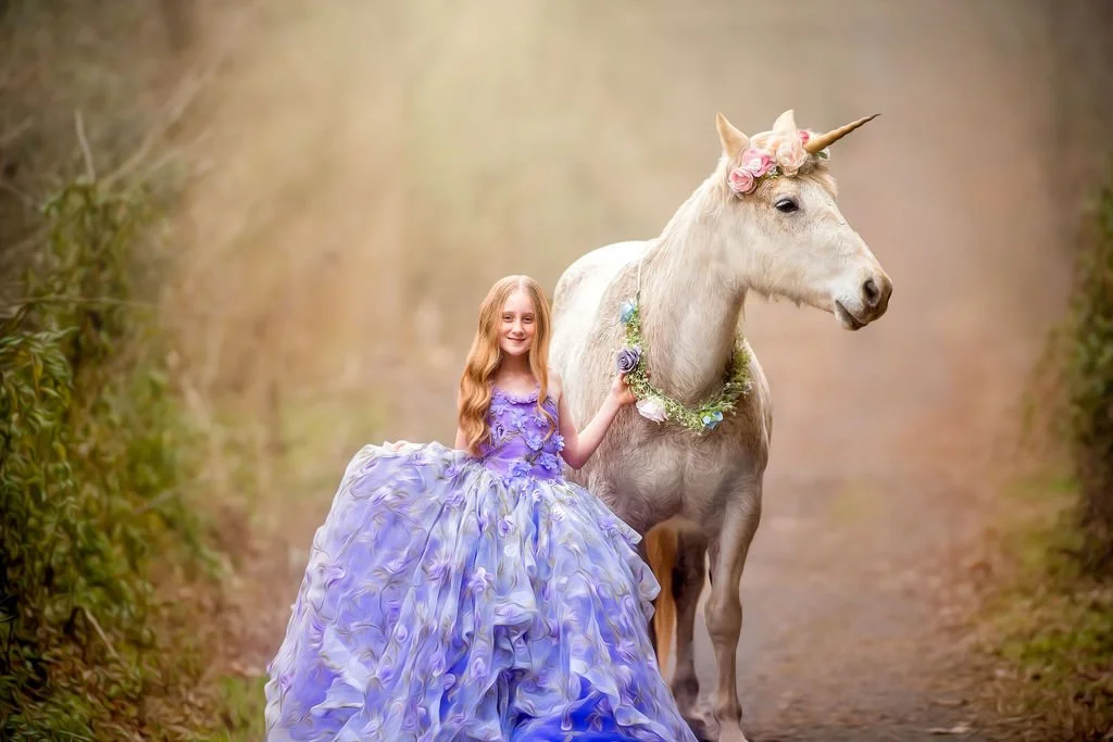Fine art winter unicorn portrait of child in jewel tone dress photographed in South Jersey