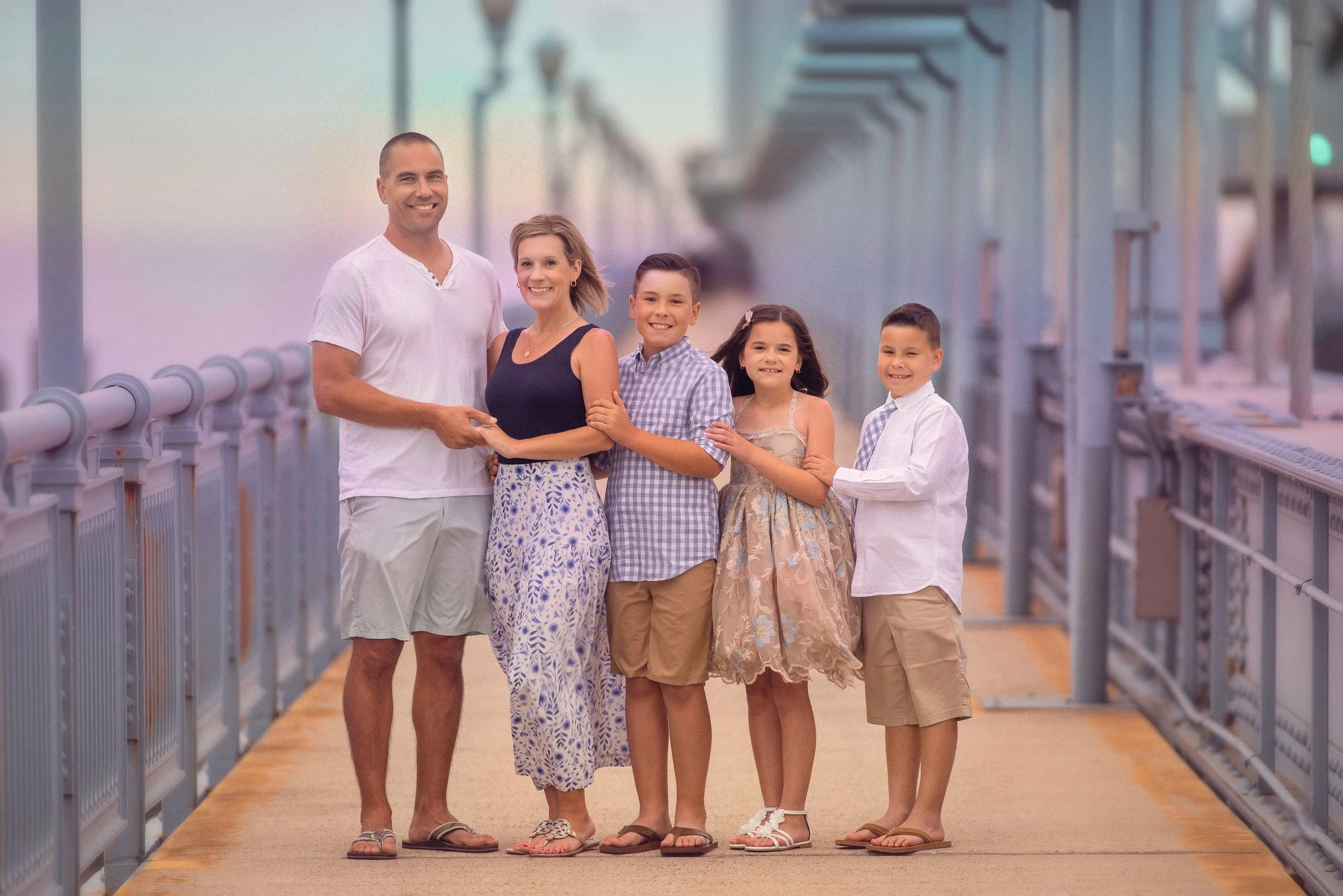 Family portrait on the Ben Franklin Bridge in Philadelphia by a fine art family photographer