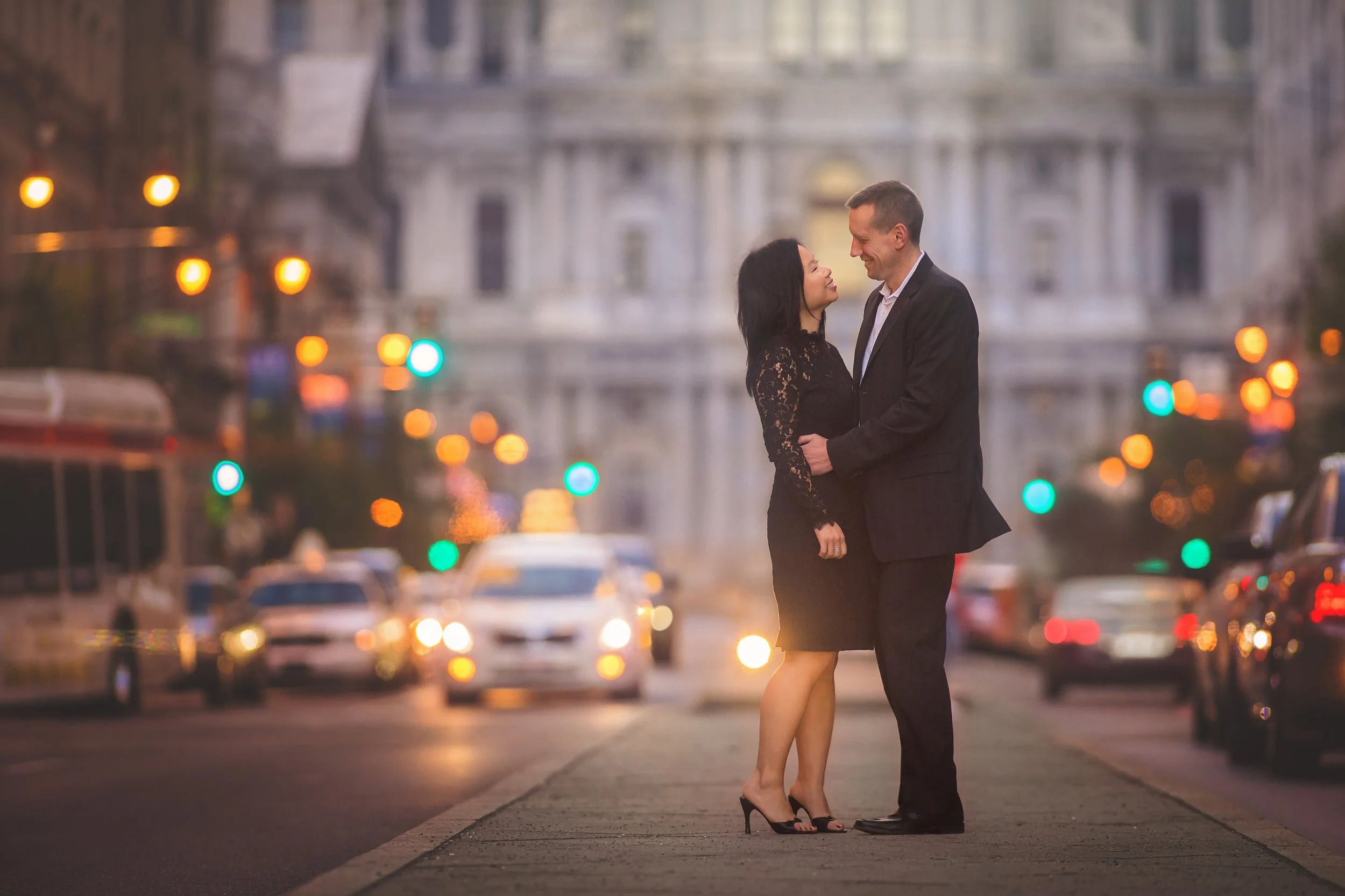Cinematic evening couples portrait featuring elegant city light and timeless romance in Philadelphia