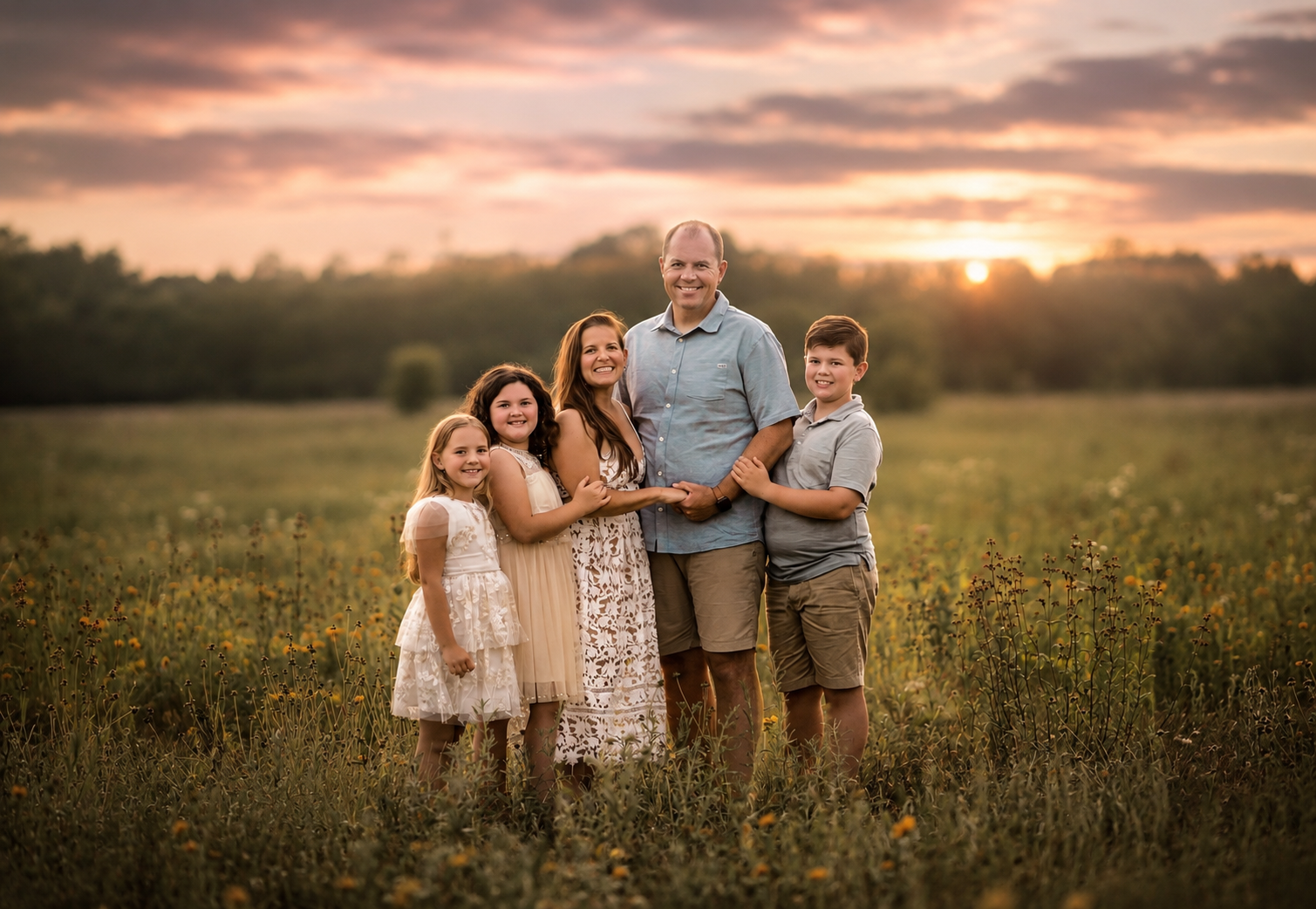 mom, dad, and three siblings pose together for family portraits in a wildflower field in New Jersey