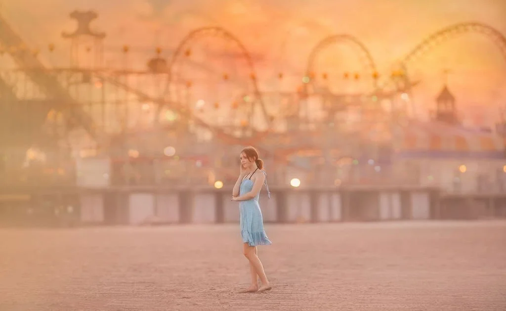 Teen girl posing on the beach in Wildwood NJ with Morey’s Pier in the background
