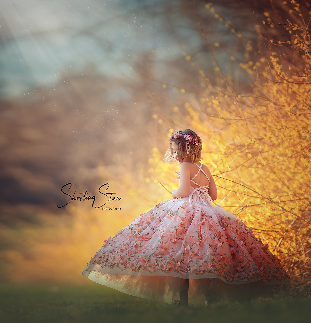 A fine art portrait of a child glowing in warm golden light, capturing the relaxed and guided feel of a spring portrait session.