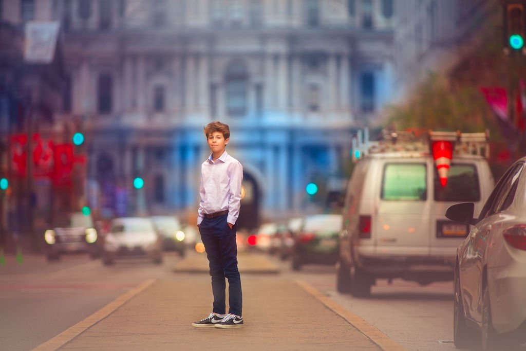 Teen boy modeling during a portrait session on Broad Street in Philadelphia.