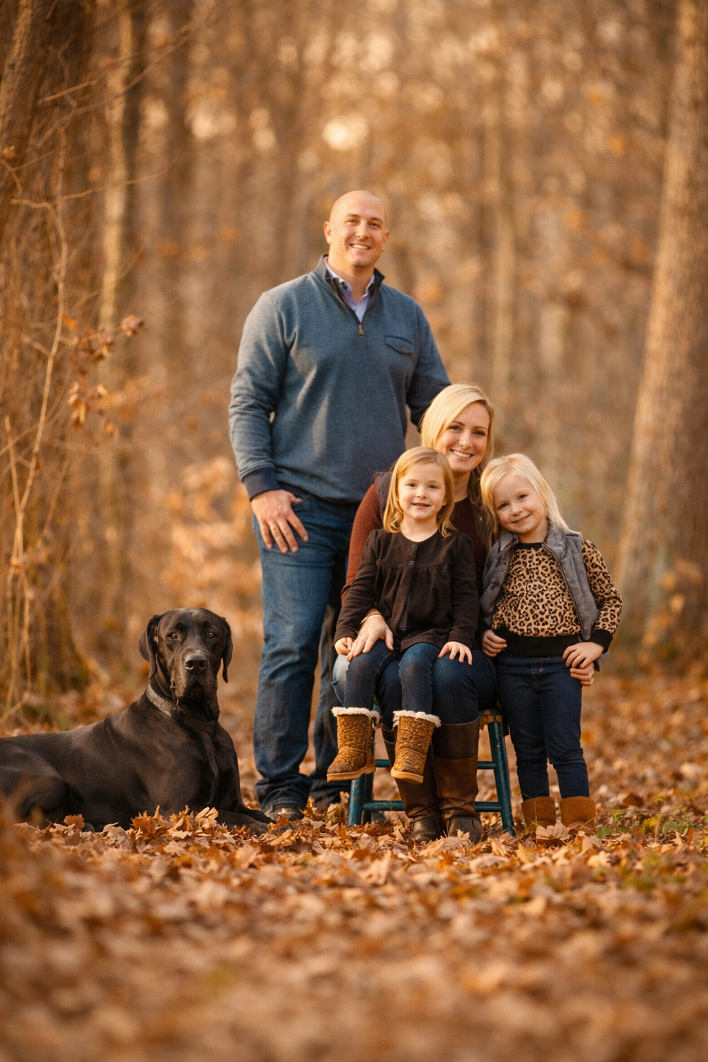South Jersey family portrait in autumn woods with children and their dog, photographed in warm neutral light