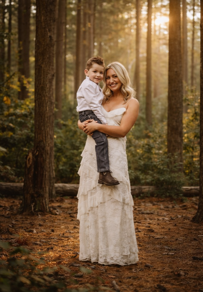 Mother gently fixing her child’s hair during a relaxed family photo session in South Jersey