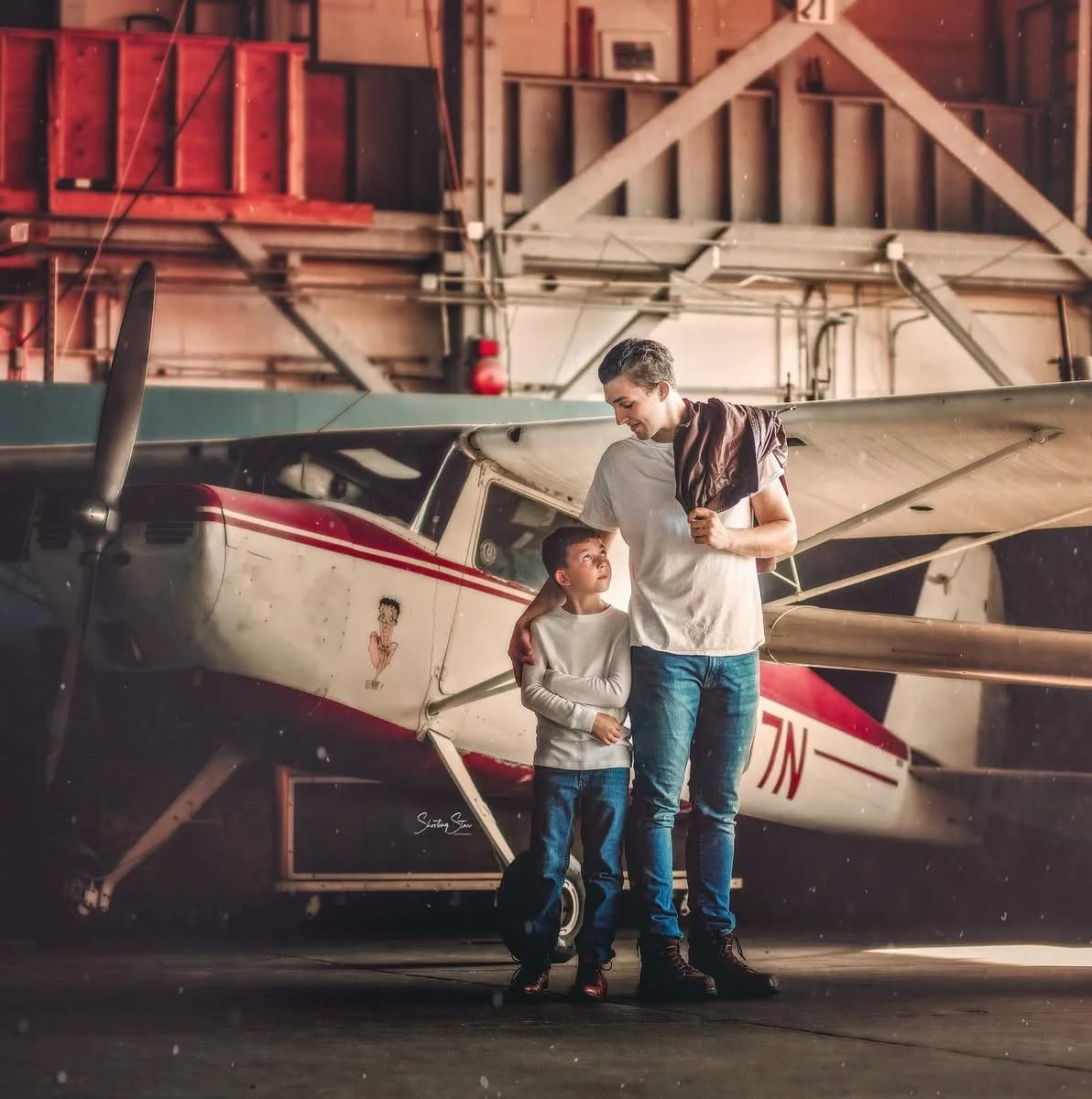 Brothers styled in aviator look during vintage airplane photoshoot in South Jersey