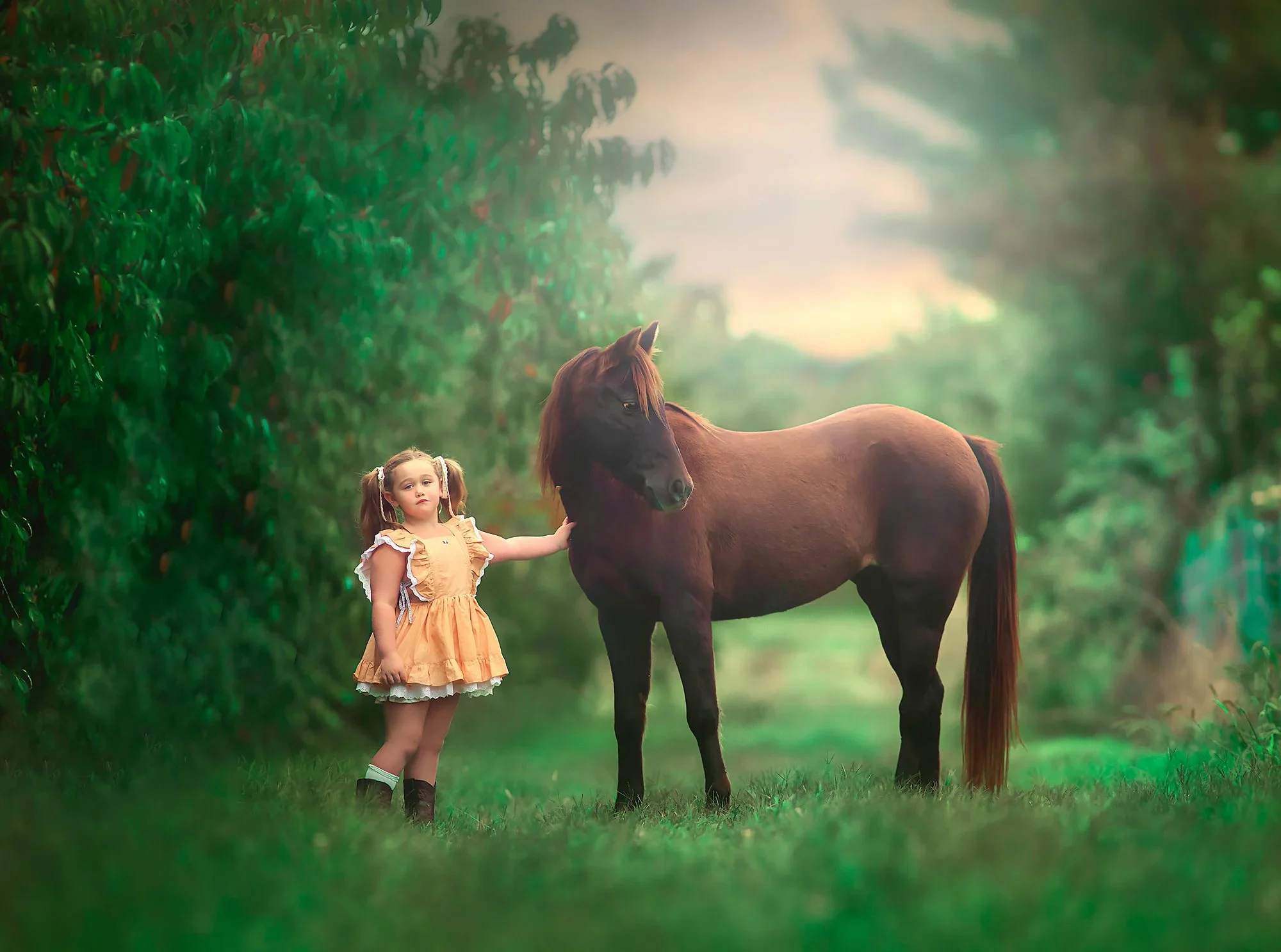 Girl posing with a pony in a peach orchard during a family portrait session in New Jersey"