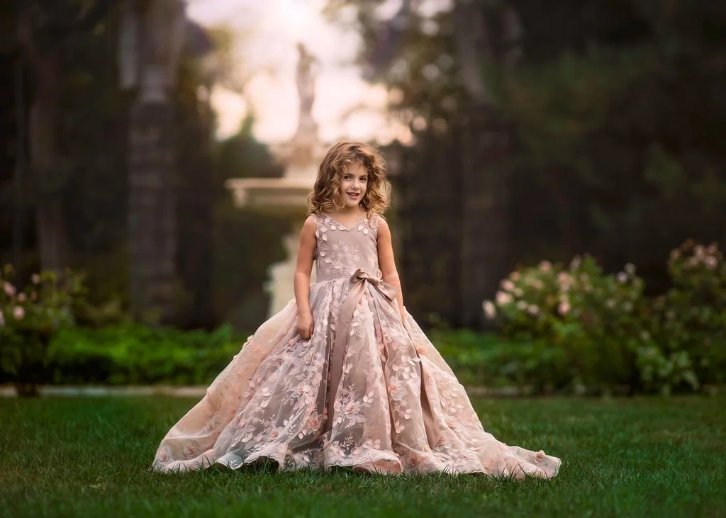 girl-pink-gown-posing-mary-coffin-gardens-delaware.jpg