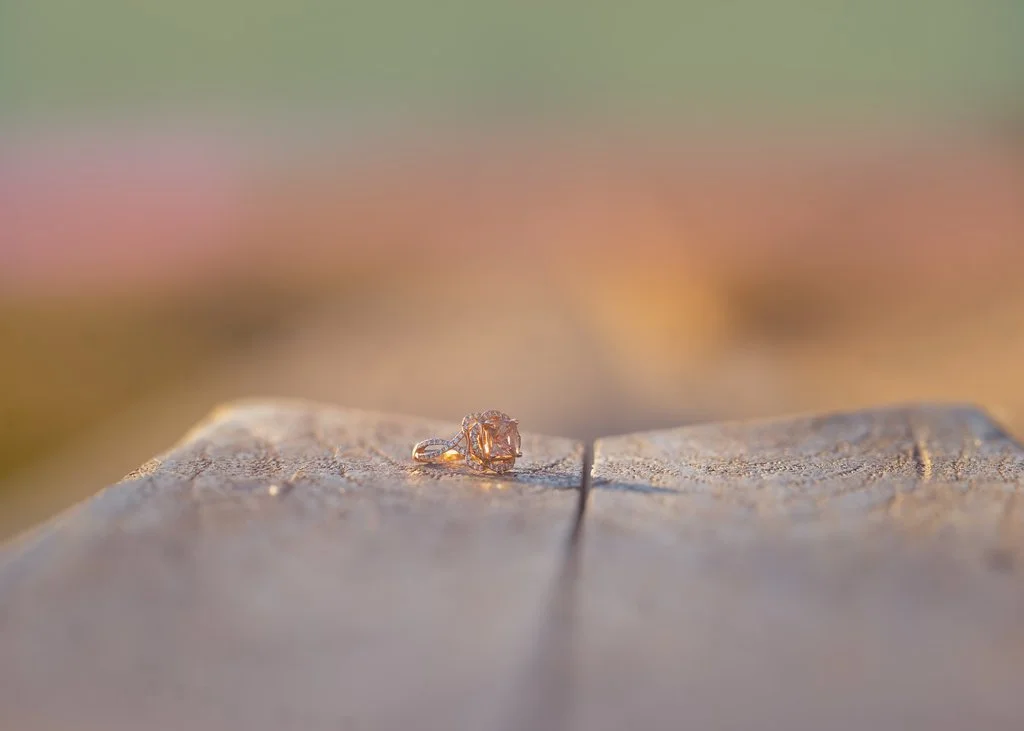 A close-up detail of an engagement ring photographed during a winter engagement session at Race Street Pier