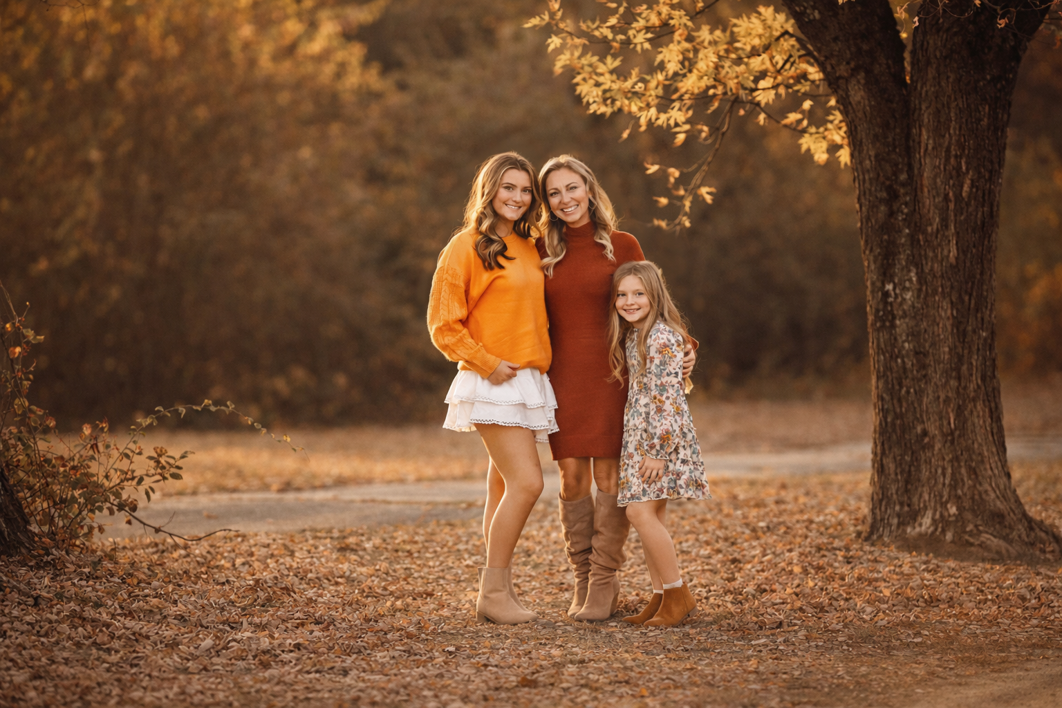 Mother and her two daughters photographed together during a fall family session in South Jersey with warm autumn tones.