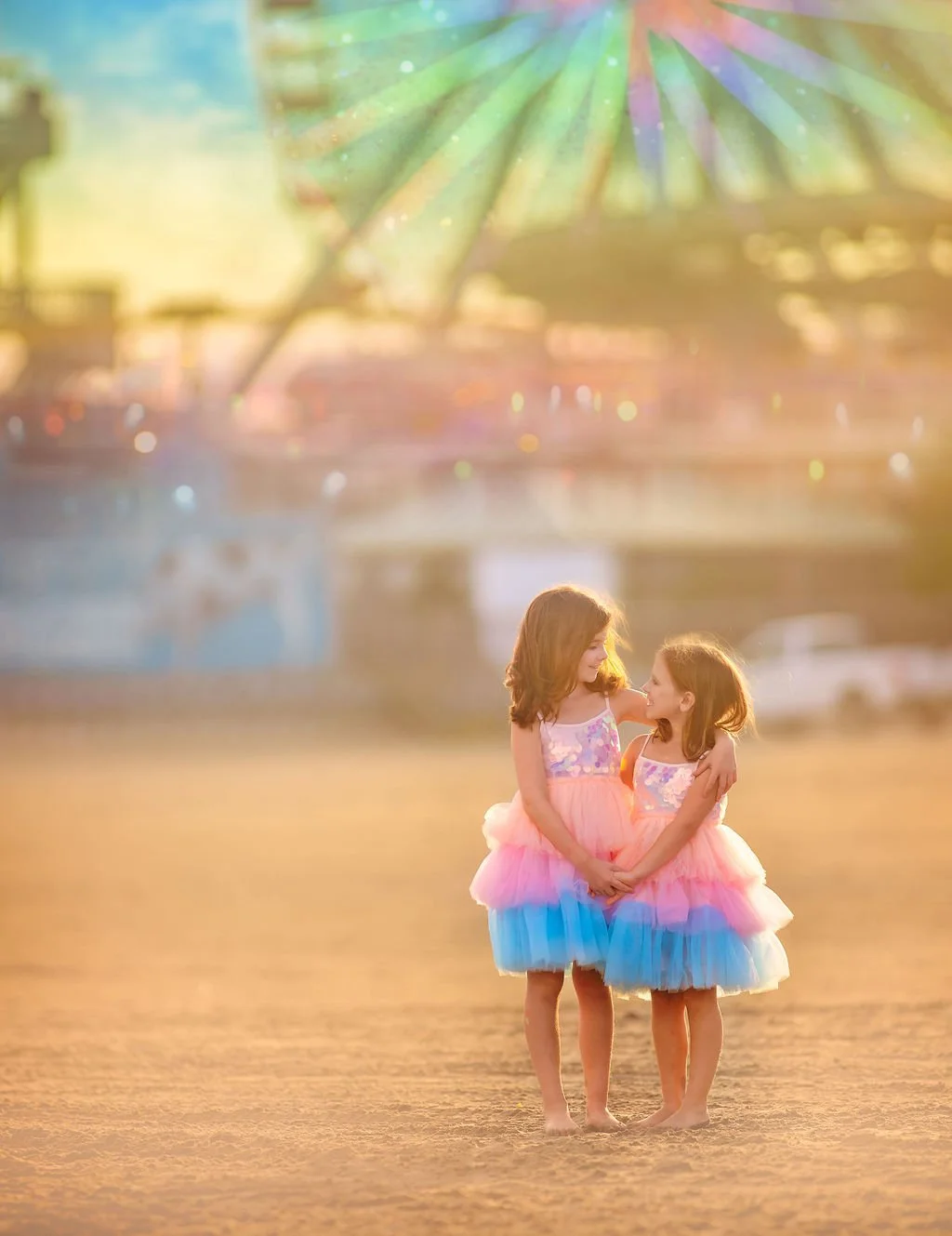 Two sisters hugging and smiling in the golden sunlight on the beach in Wildwood, NJ.