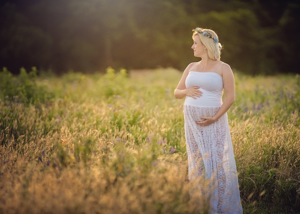 pregnant woman wearing white gown during South Jersey maternity portrait session