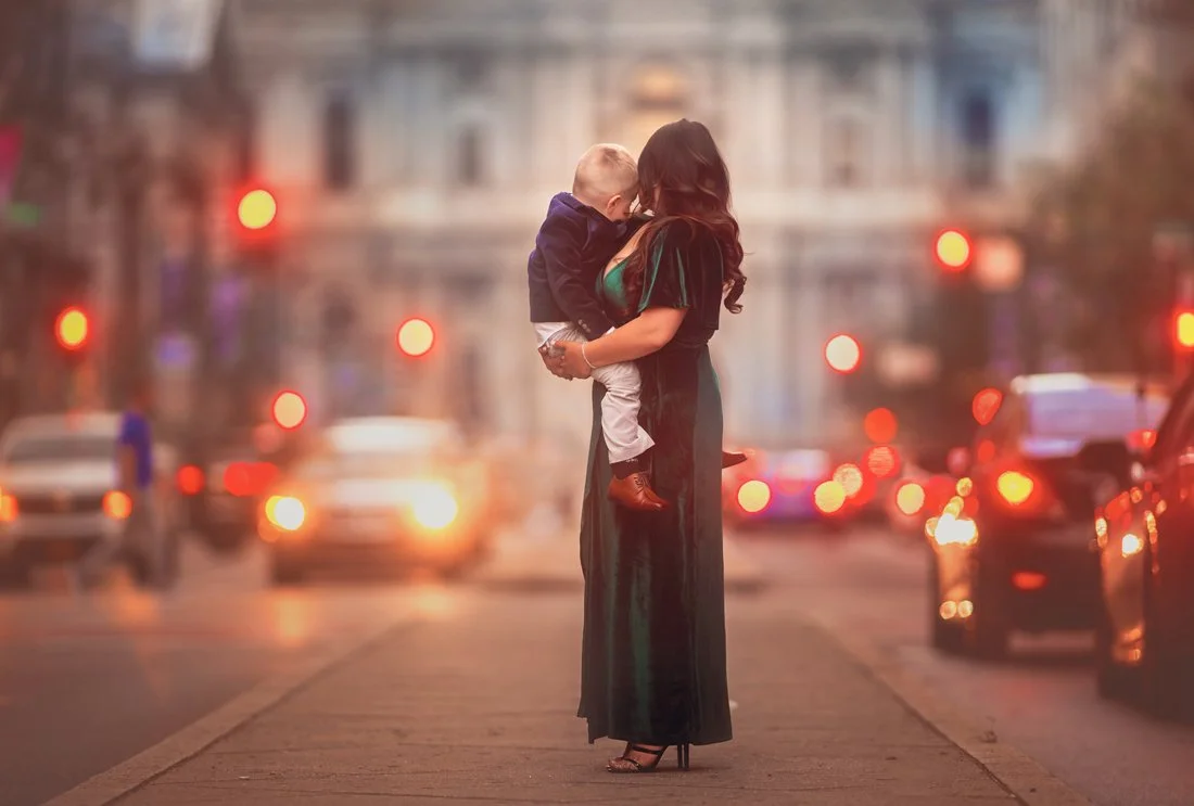 Fine art family portrait of a mother holding her young child in an urban Philadelphia setting by a South Jersey family photographer