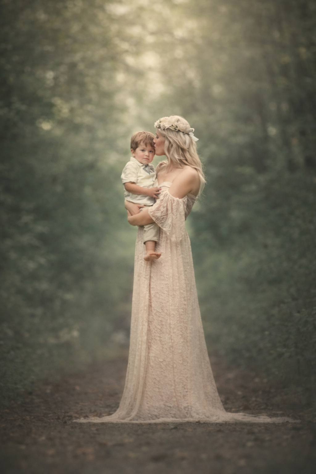 Mother holding her toddler during a natural light family mini session in a scenic outdoor location