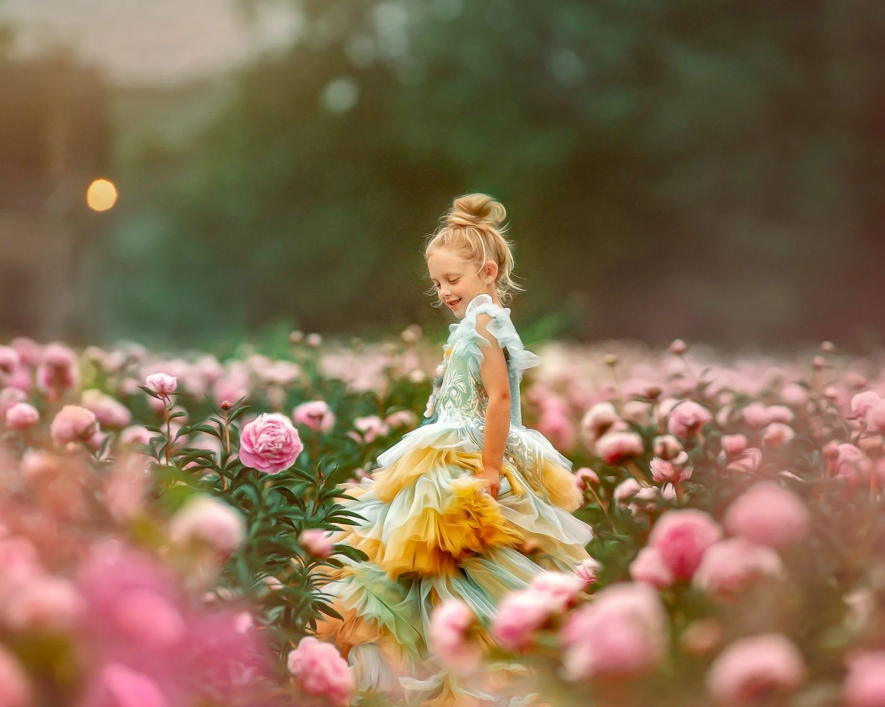Girl in blue dress twirling in pink peony field during South Jersey portrait session