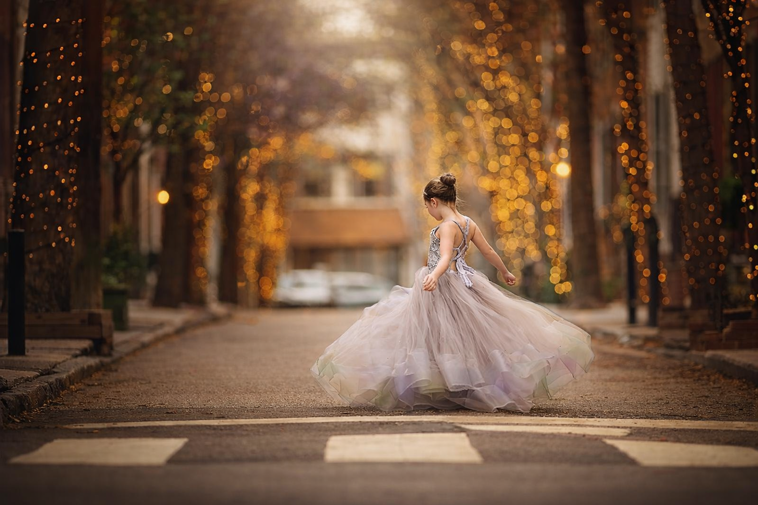 image of a girl twirling in Rittenhouse square for a Princess portrait session in Philadelphia