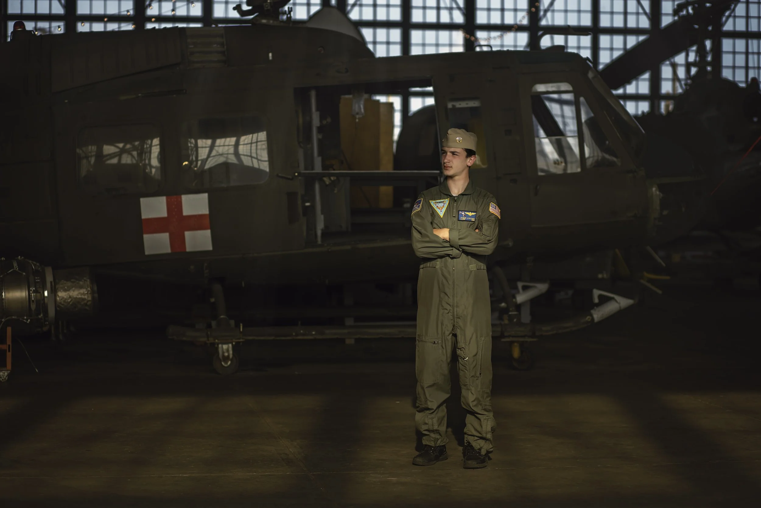 Teen posing in front of medical helicopter during aviation photoshoot near Cape May New Jersey