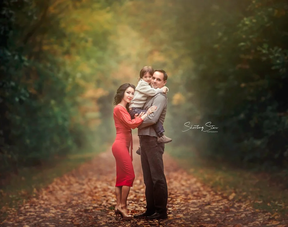 Family in the forest during a golden hour photo session in South Jersey with their young son