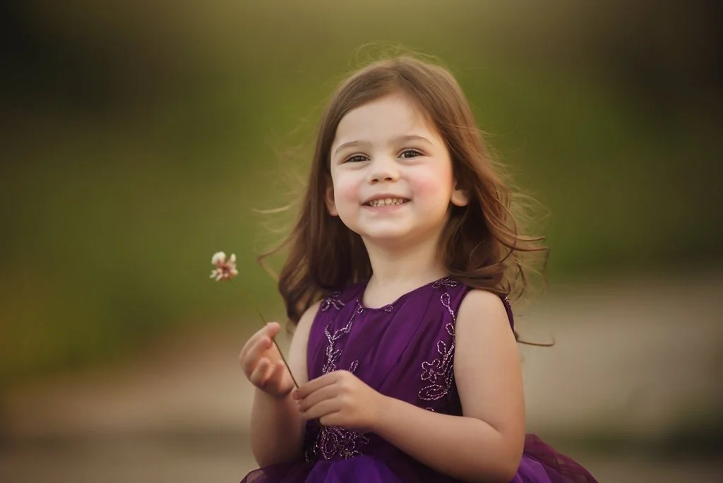 toddler girl wearing purple gown during New Jersey children portrait session