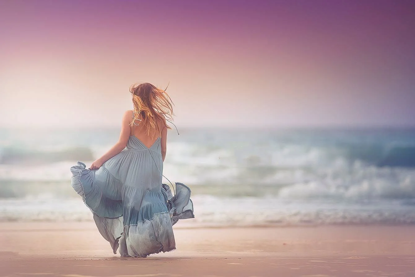 golden hour beach portrait of a child in a designer dress running barefoot towards the water, South Jersey