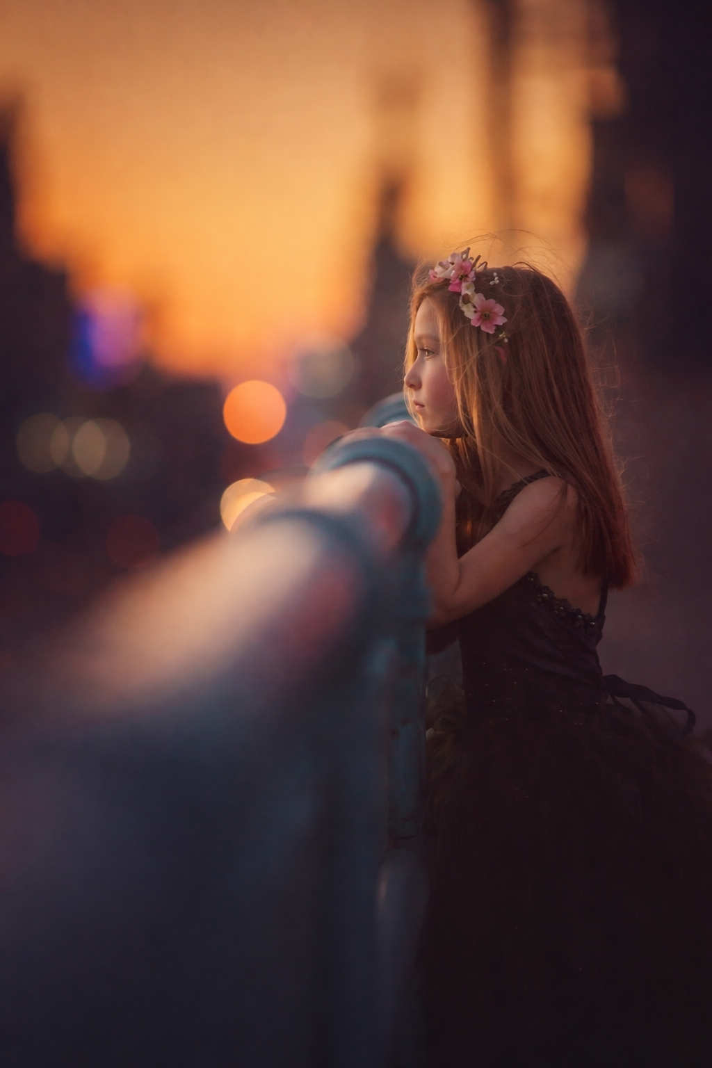 Child portrait in Philadelphia at sunset, photographed with soft city lights and a fine art, dreamy feel