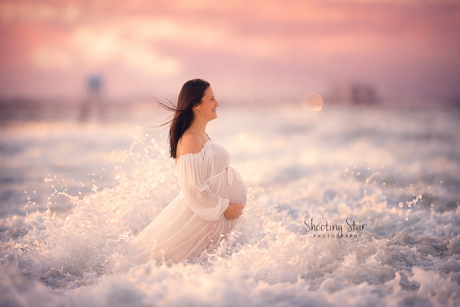 Expectant mother standing in the ocean during a South Jersey maternity photography session