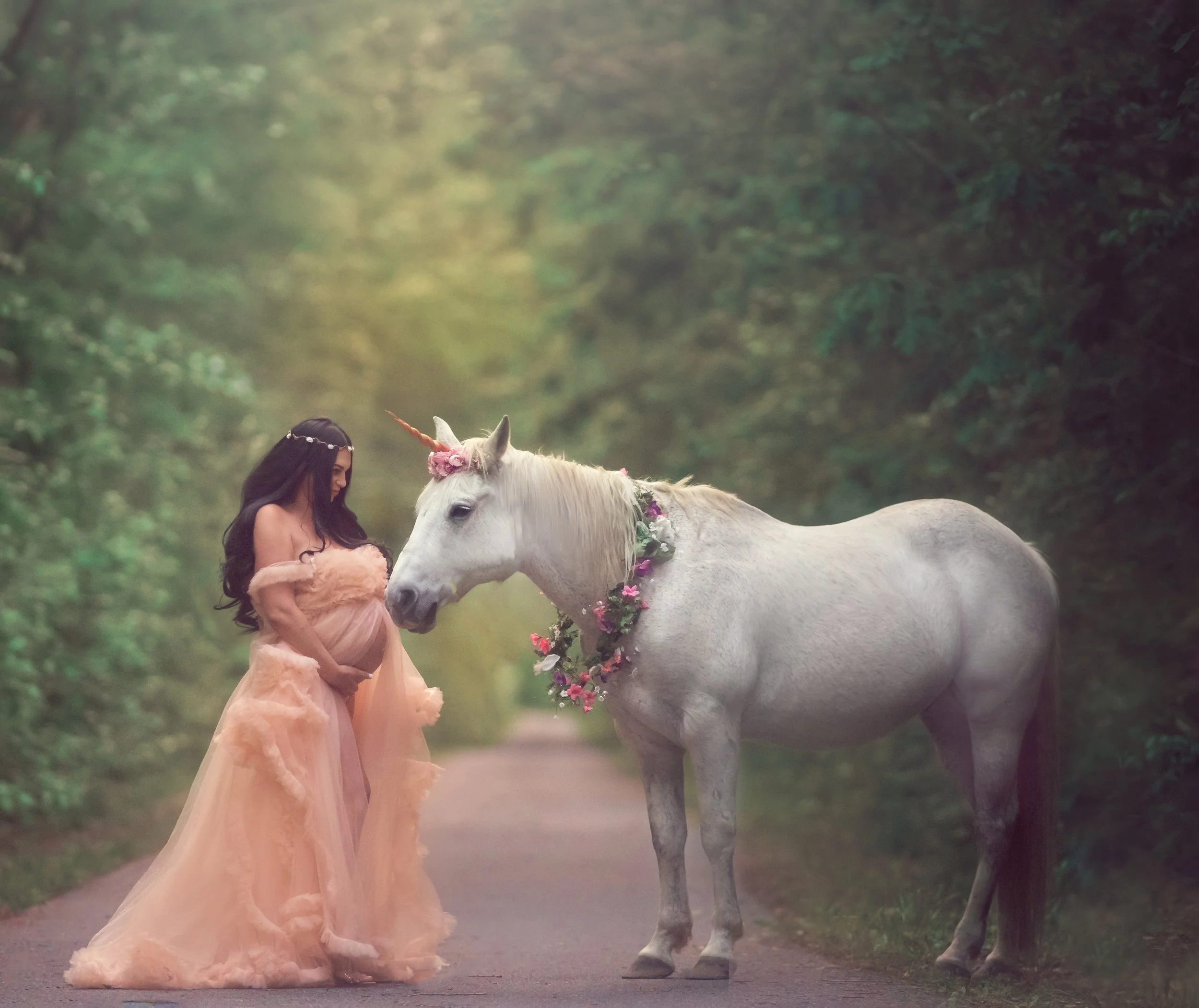pregnant mother with unicorn during fine art maternity photography session in New Jersey
