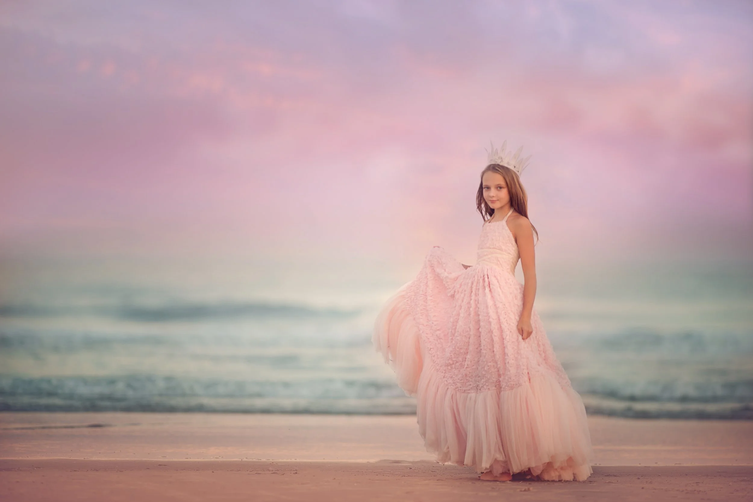 Child posing on the beach in a flowing dress during a Wildwood NJ photography session captured by a South Jersey photographer.