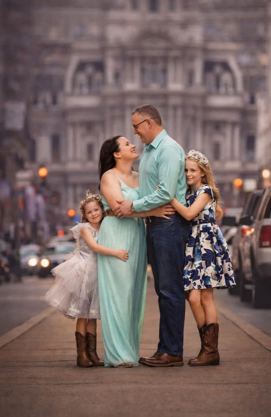 family in blue enjoying a beautiful moment together for their photo session in downtown Philadelphia