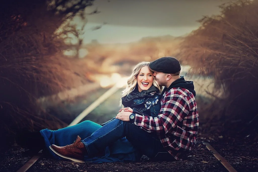 Engaged couple sharing a candid moment during a winter engagement session near Race Street Pier
