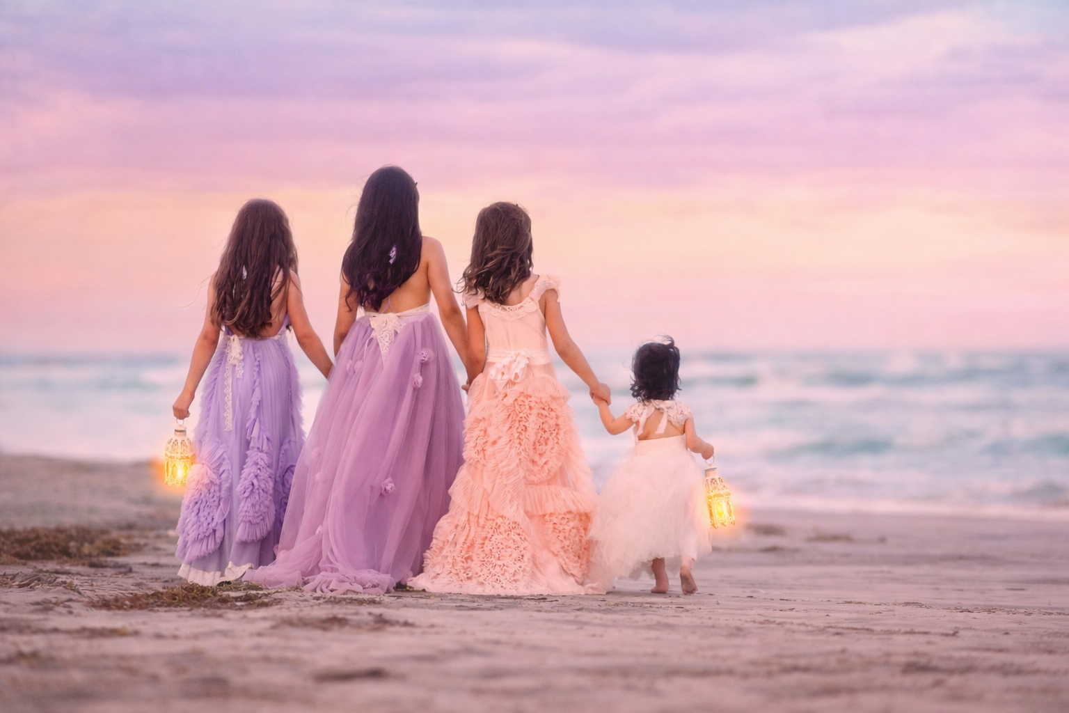 children holding lanterns walking toward the ocean at sunset in Ocean City New Jersey