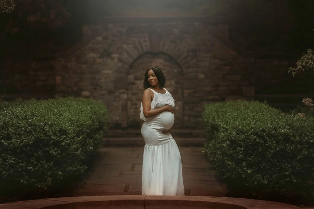 Expectant mother posing at Ridley Creek State Park during a maternity photography session near Philadelphia and South Jersey