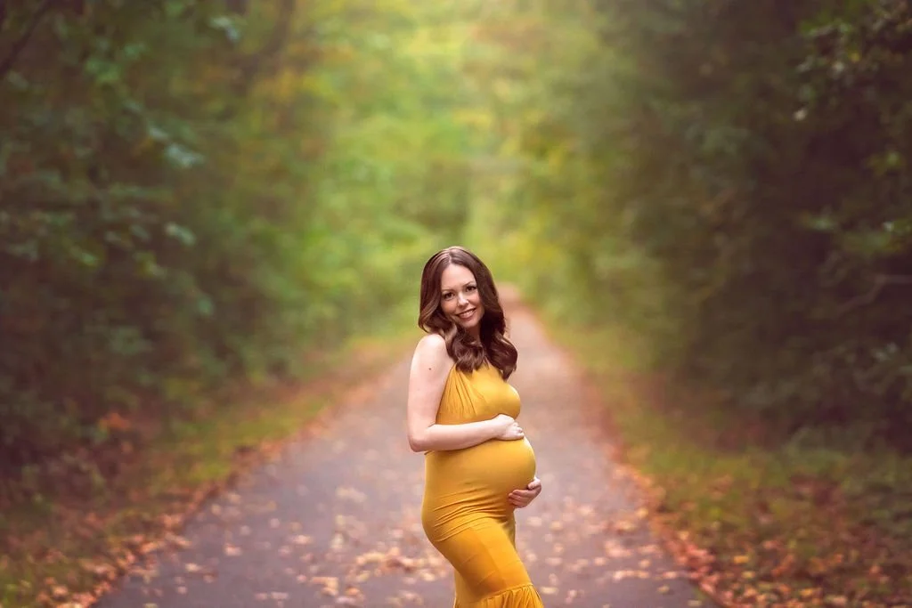 Closeup maternity portrait of a pregnant mother outdoors during a fine art maternity photography session in South Jersey.