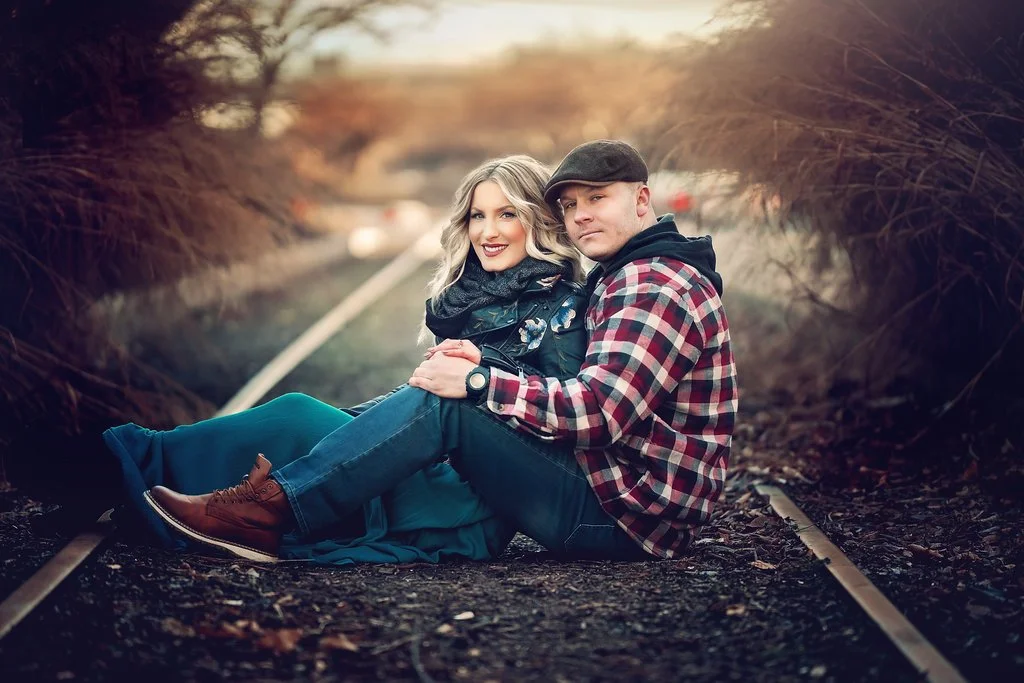 Engaged couple smiling together during a winter engagement session near Race Street Pier in Philadelphia
